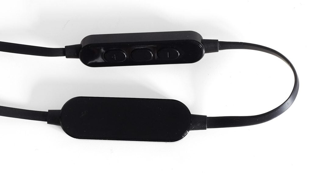 Close-up of Focal Spark Wireless earphones' inline controls and battery.