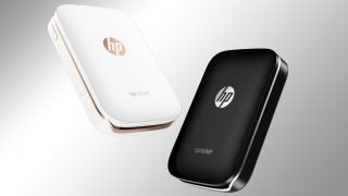 White and black HP Sprocket portable printers.