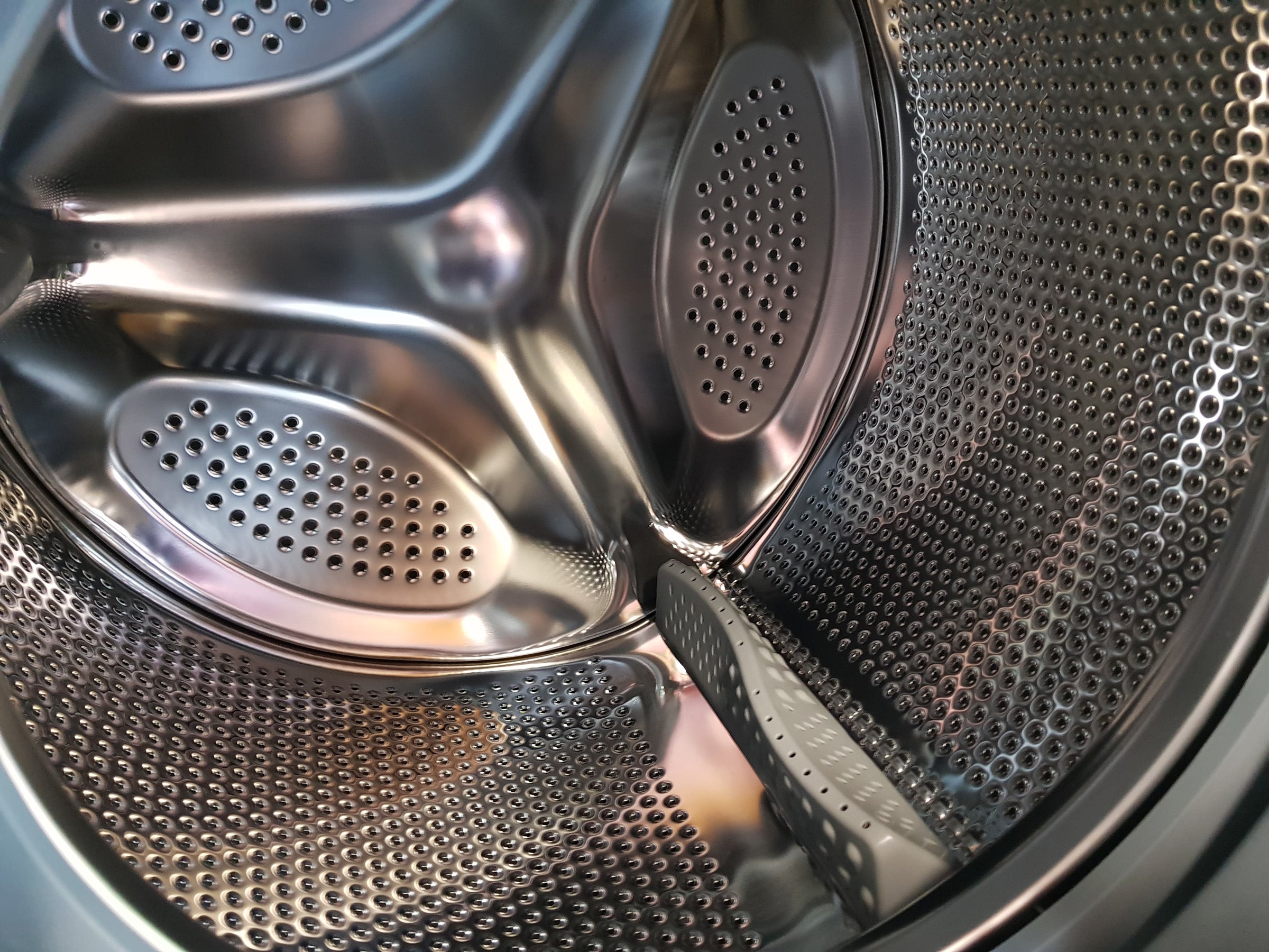 Close-up of Logik L814WM16 washing machine drum interior.