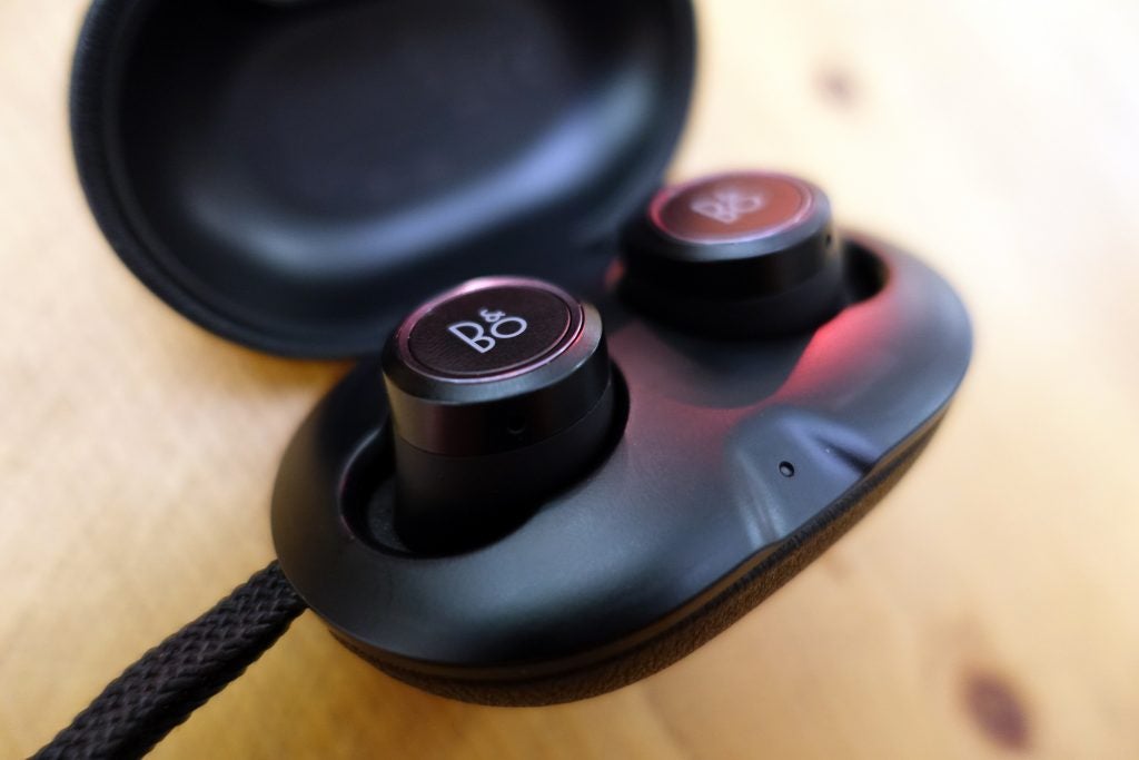 B&O Beoplay E8 wireless earbuds in charging case.