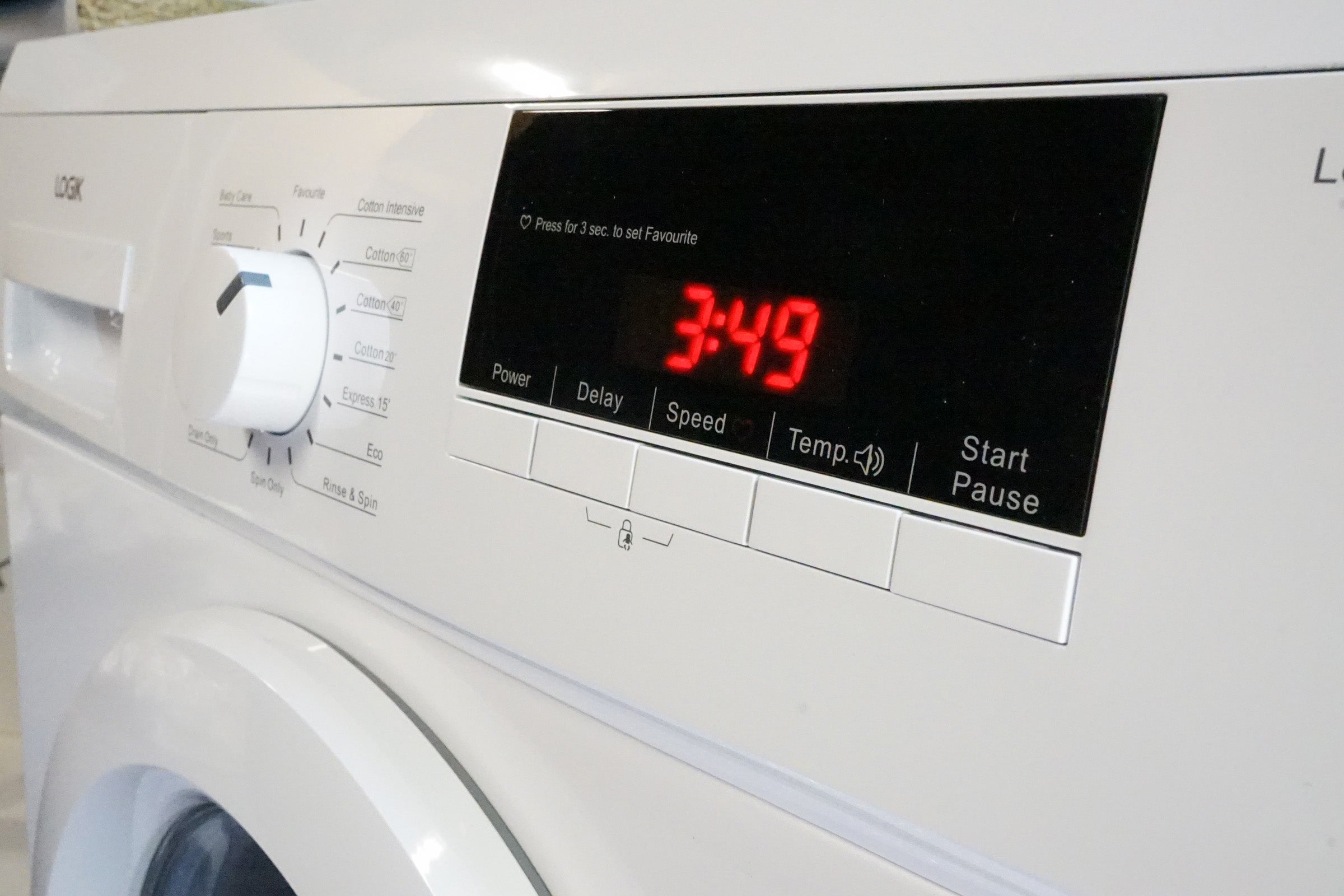 Close-up of Logik L814WM16 washing machine control panel.