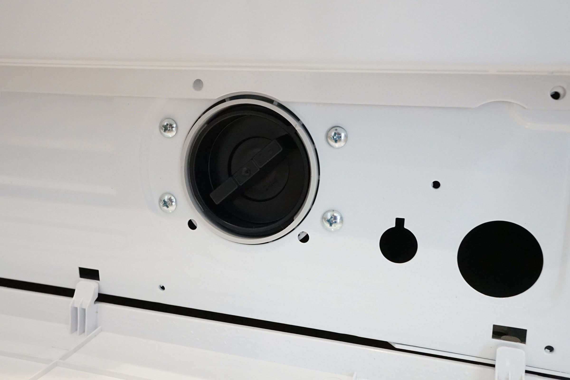 Close-up of Logik L814WM16 washing machine drain pump.