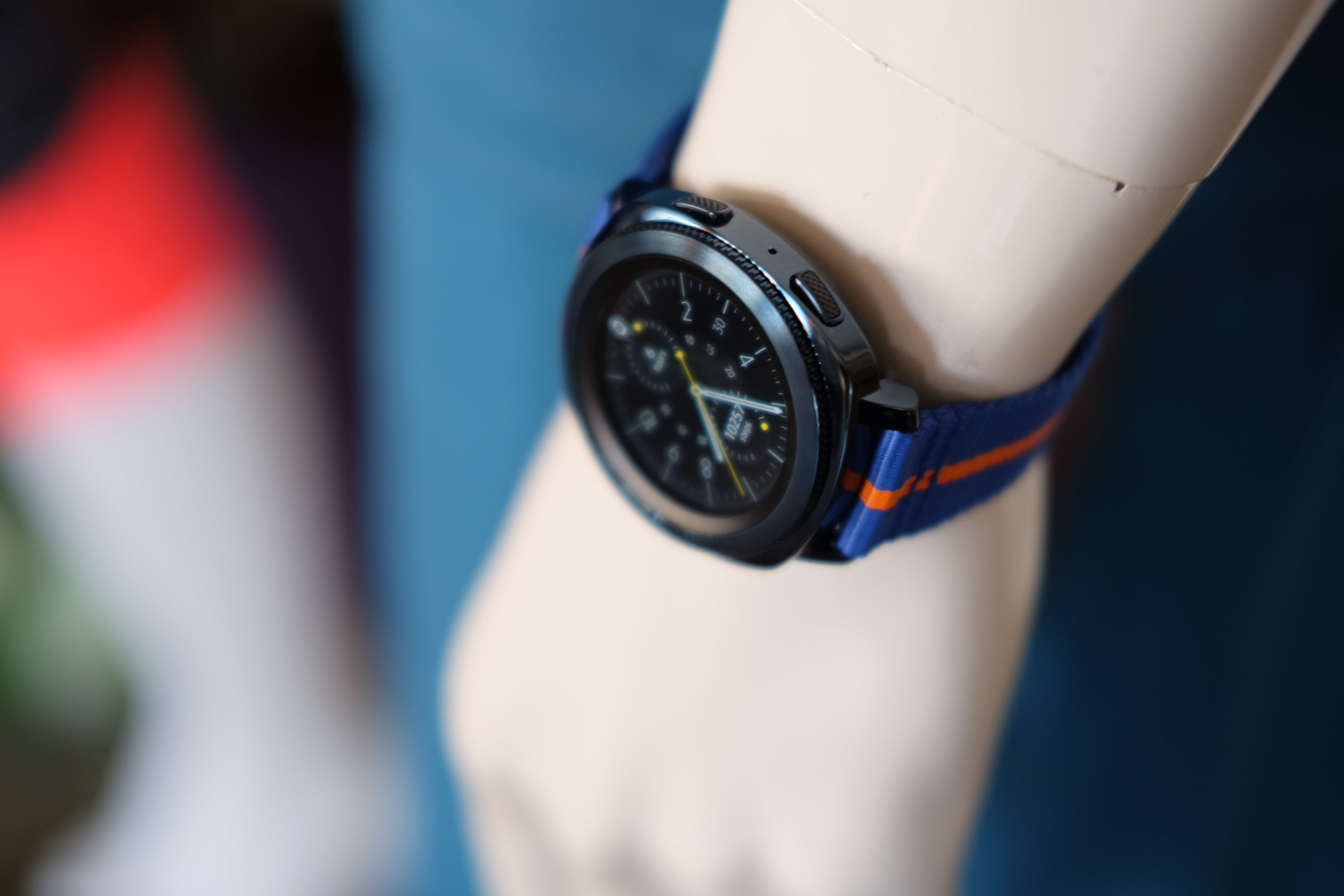 Samsung Gear Sport smartwatch on a display stand.