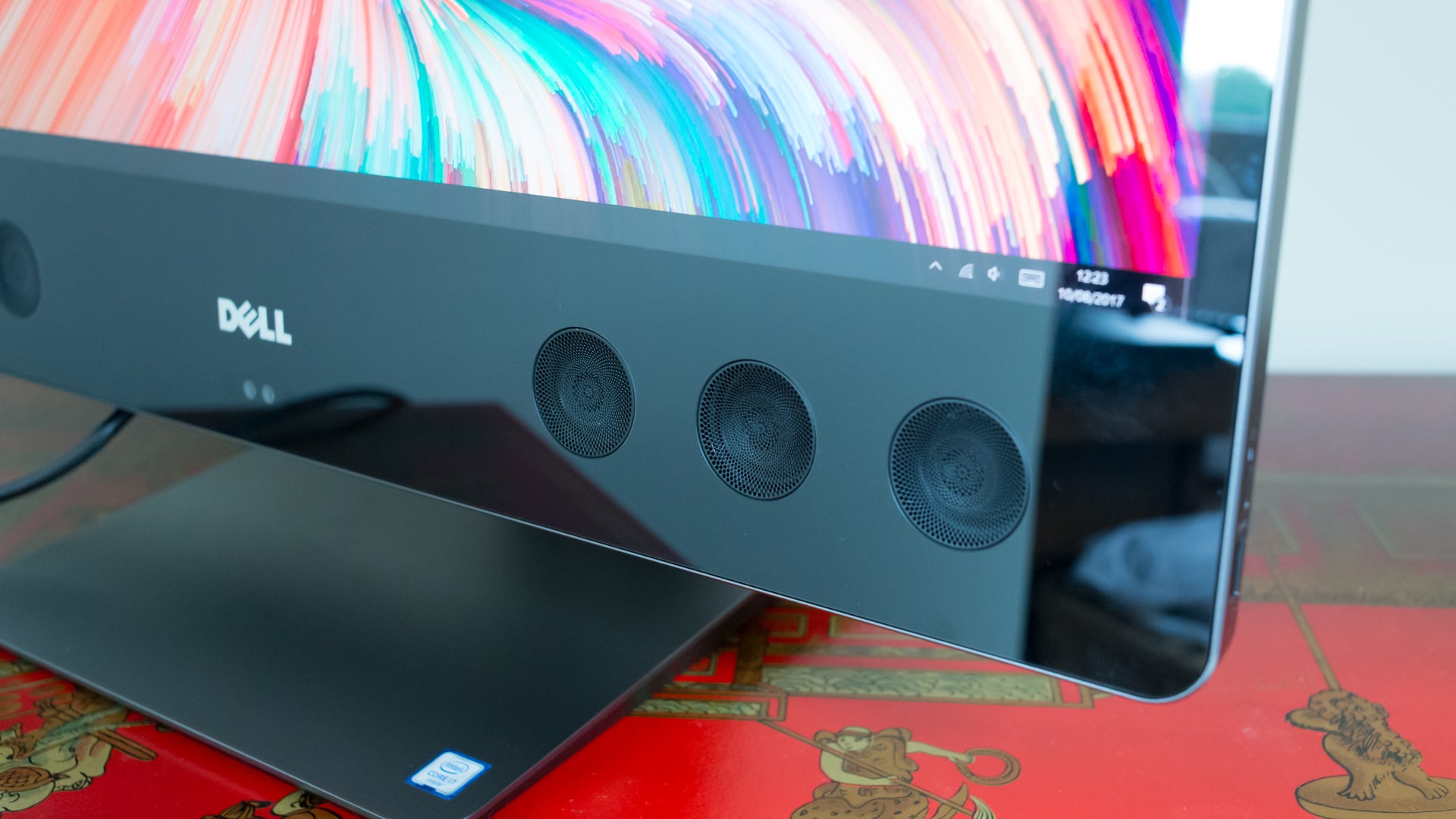Dell XPS 27 All-in-One computer with speaker grille visible.