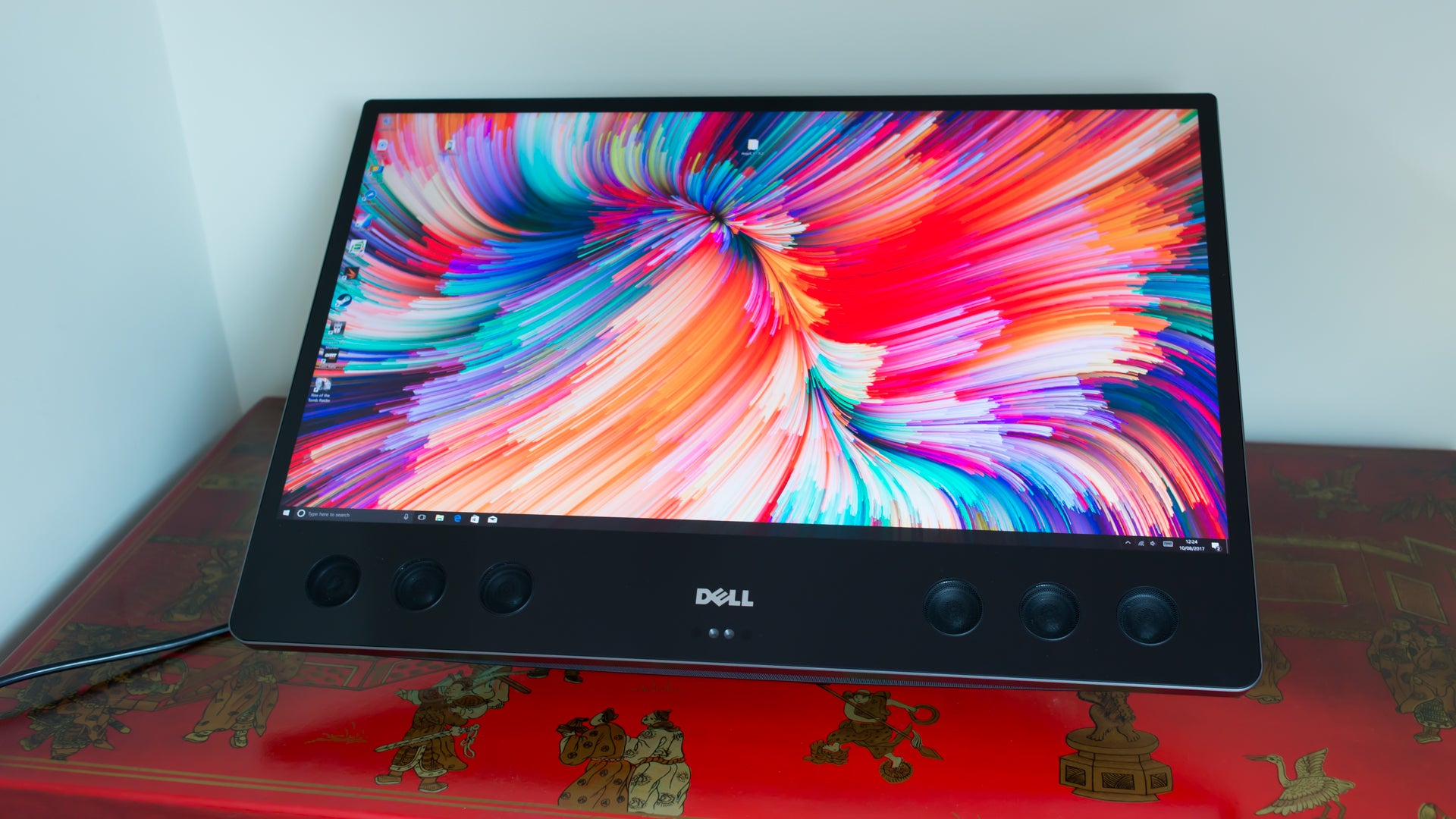 Dell XPS 27 All-in-One with vibrant display on desk.