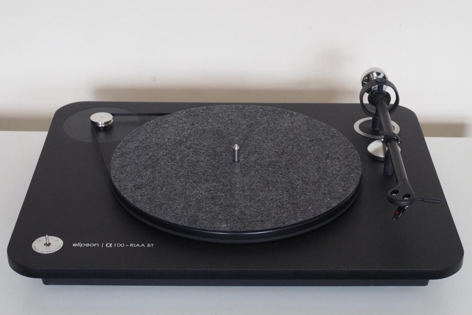 Elipson Alpha 100 RIAA BT turntable on a white surface.