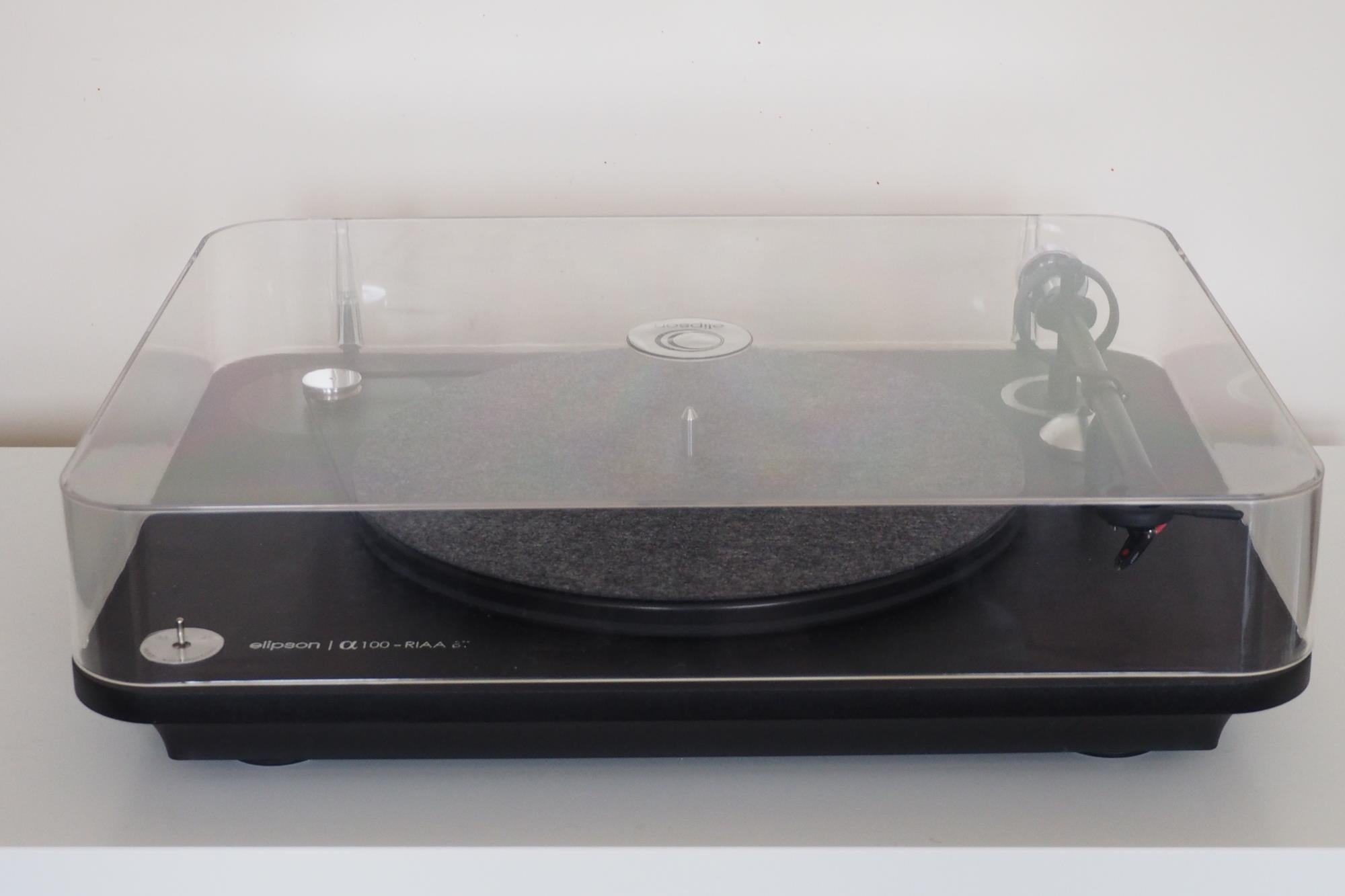 Elipson Alpha 100 RIAA BT turntable with dust cover.
