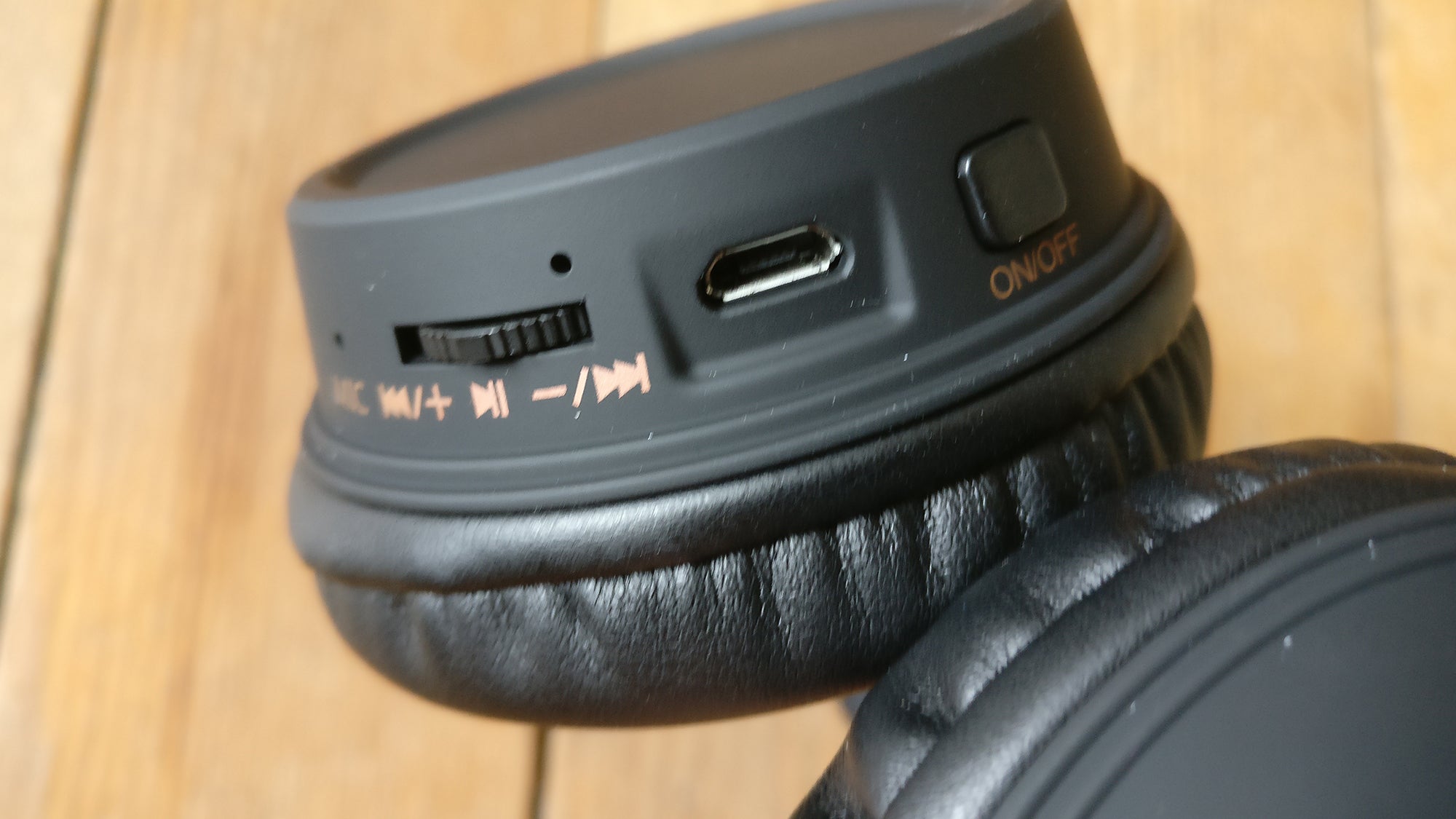 Close-up of KitSound Harlem headphones control buttons and ports