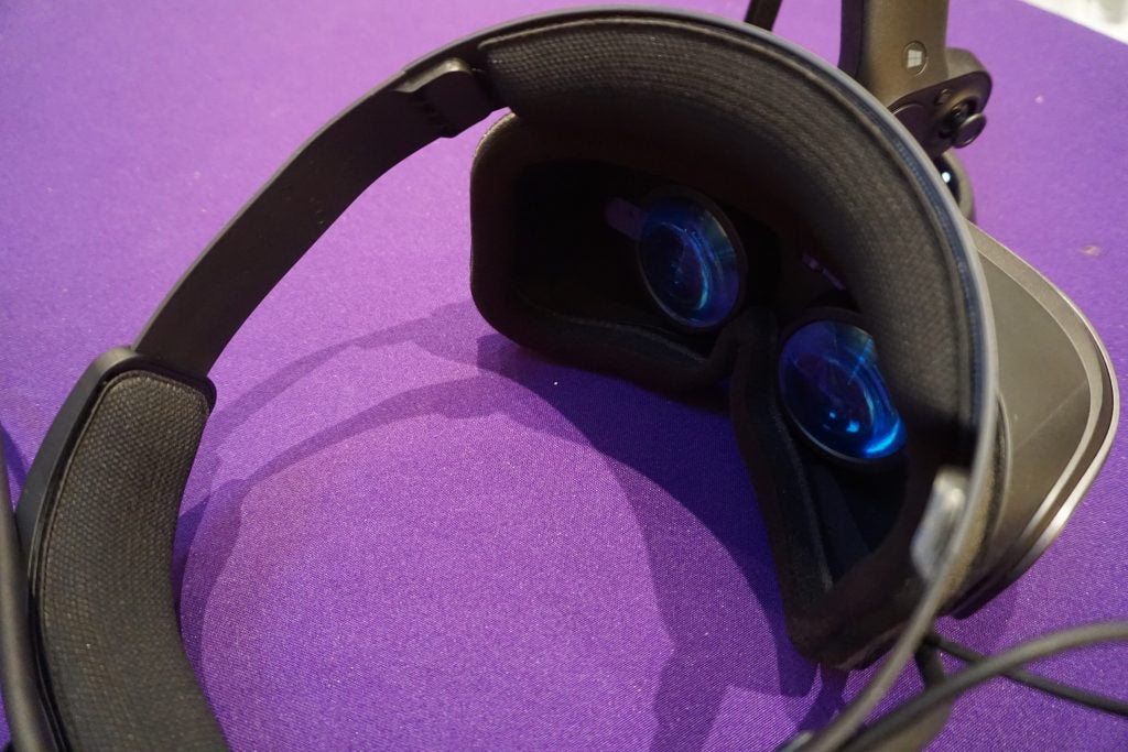 Close-up of Lenovo Explorer VR headset on purple surface.