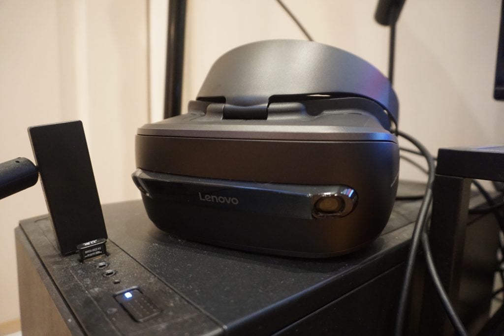 Lenovo Explorer VR headset on a black speaker.