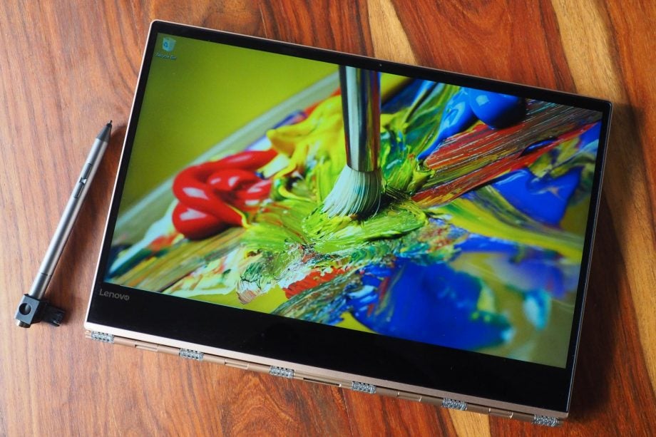 Lenovo Yoga 920 laptop with pen and vibrant display.