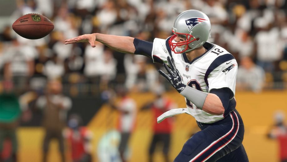 Screenshot of Madden 18 gameplay showing a quarterback throwing the football.