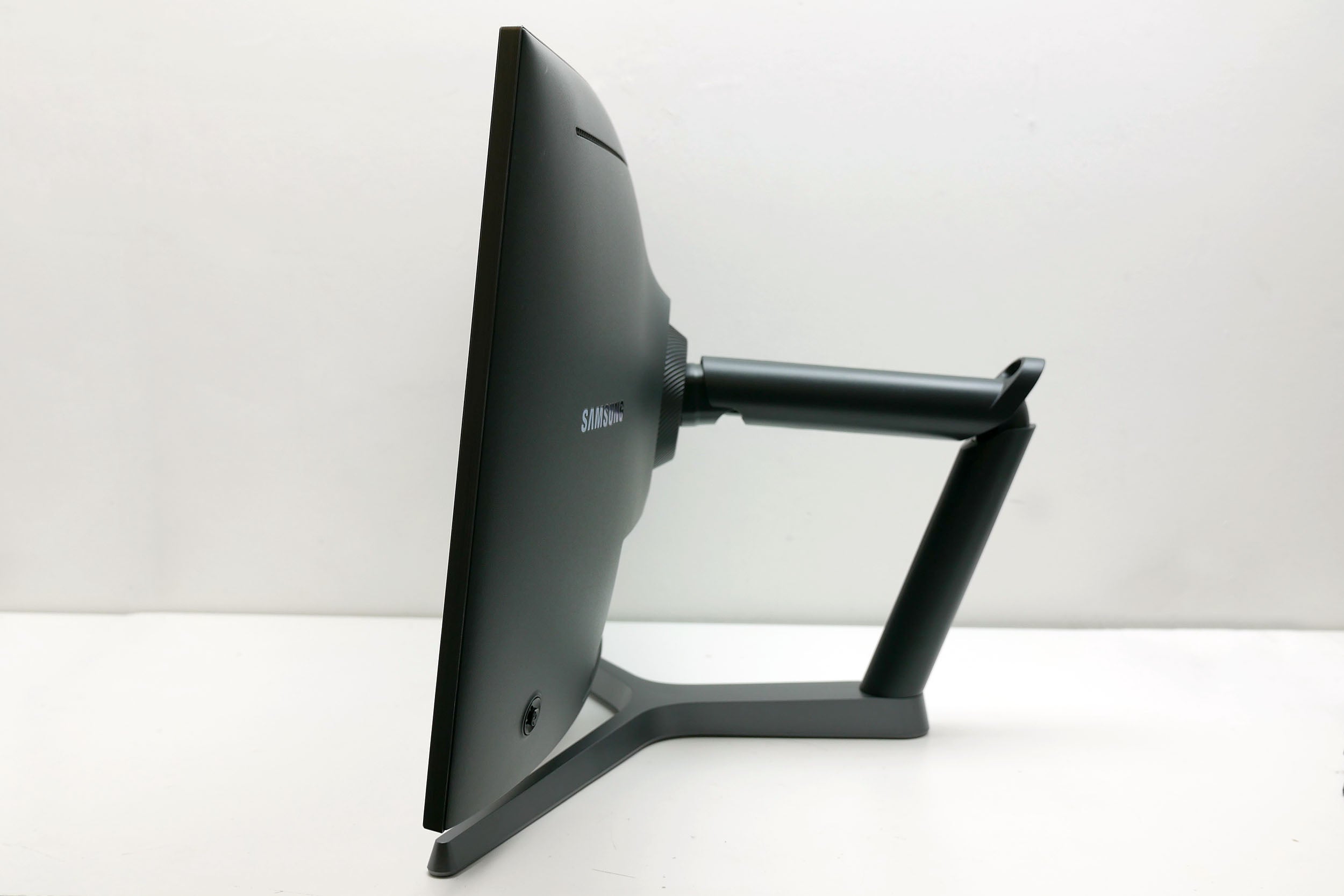 Side view of Samsung CHG70 gaming monitor on stand.