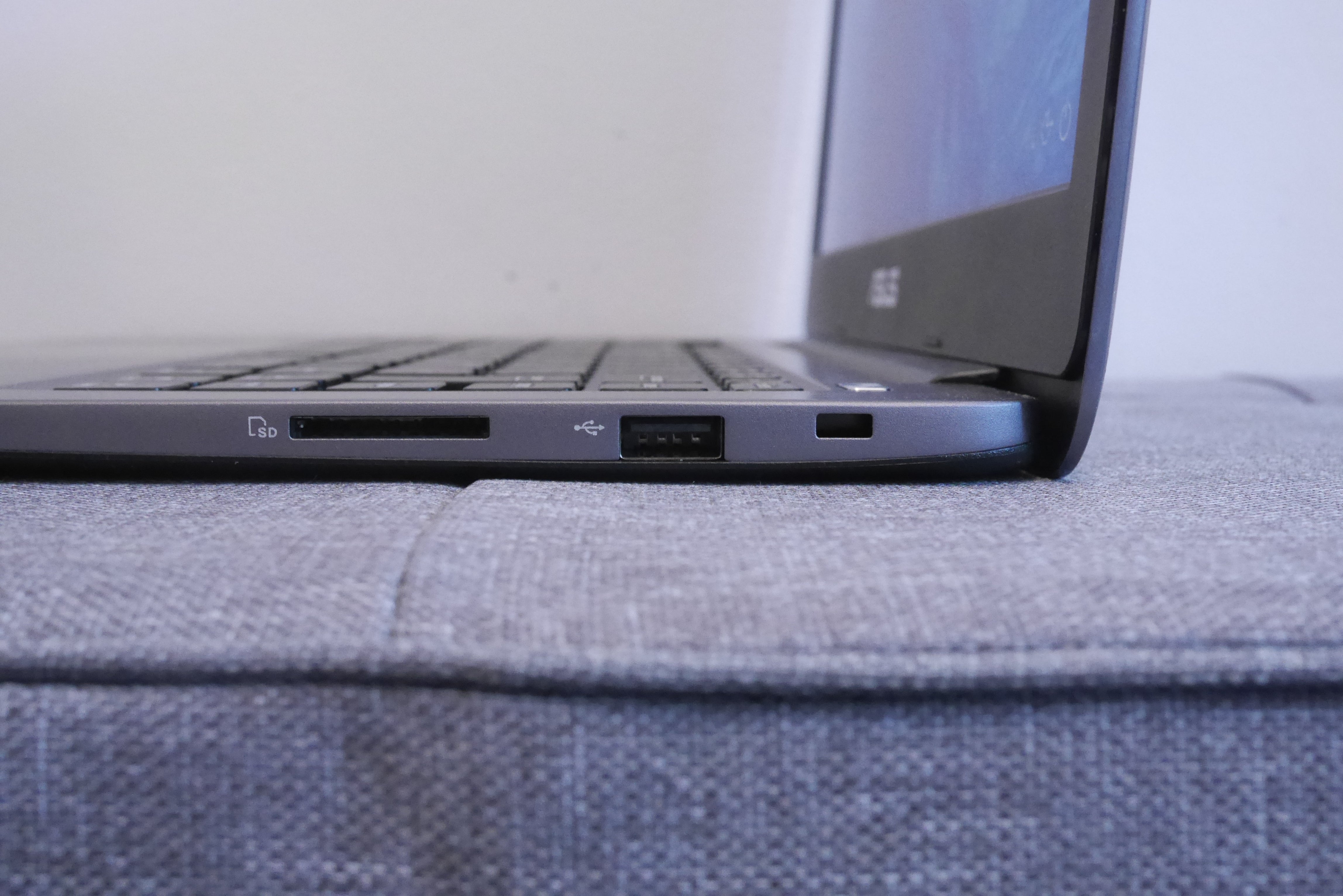 Side view of Asus VivoBook L403 showing ports.