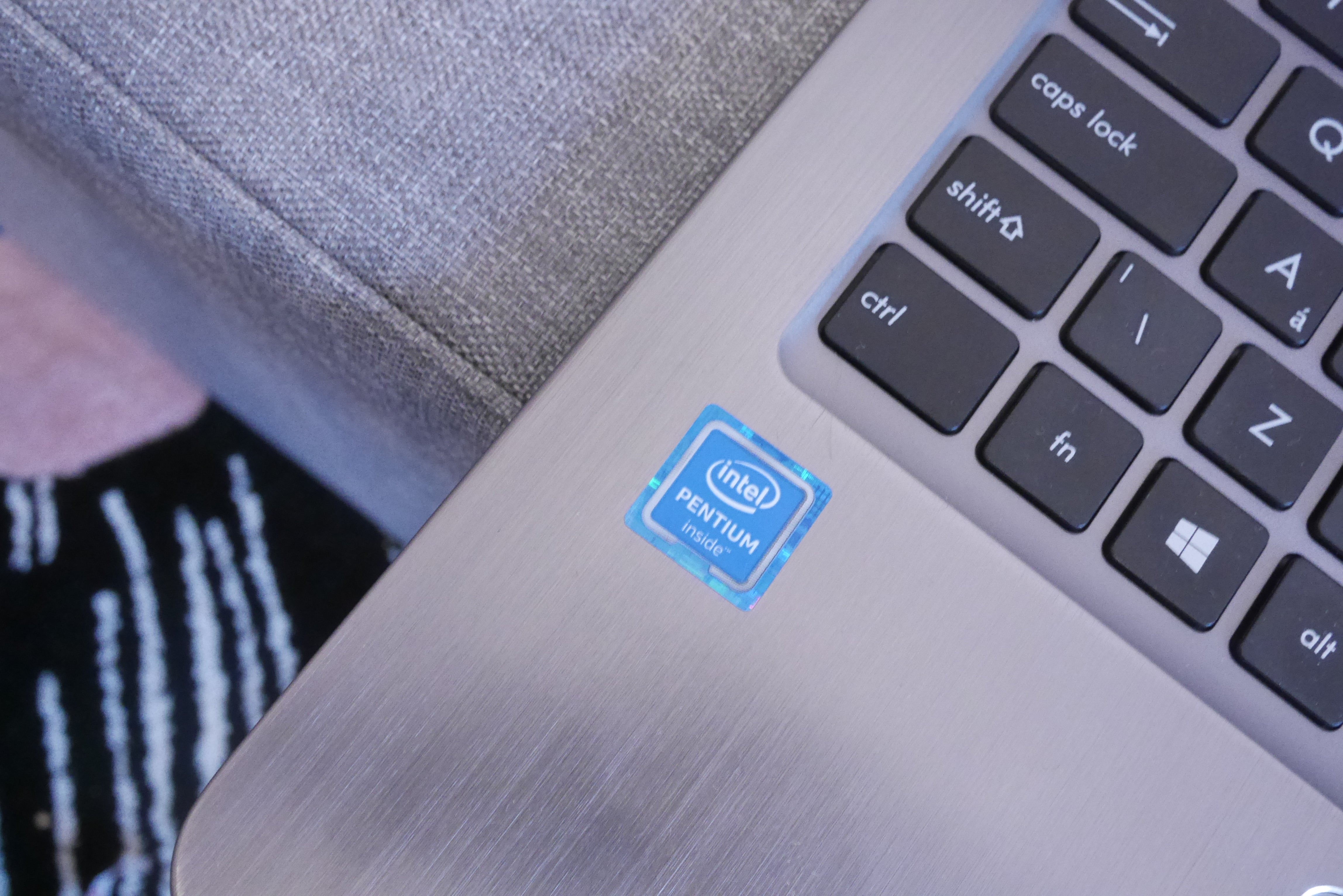 Close-up of Asus laptop with Intel Pentium sticker.