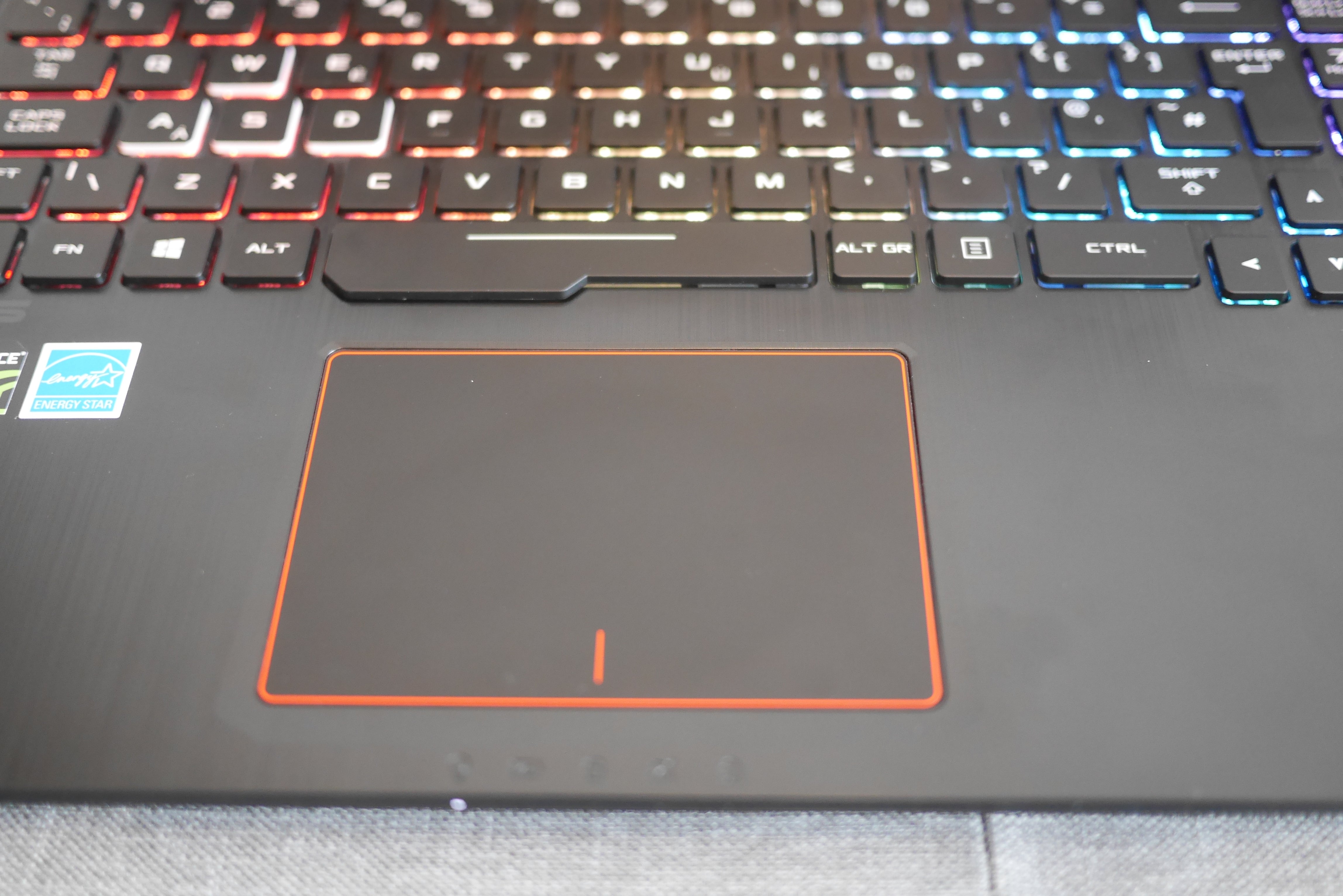 Asus ROG STRIX GL553 laptop keyboard and touchpad close-up.