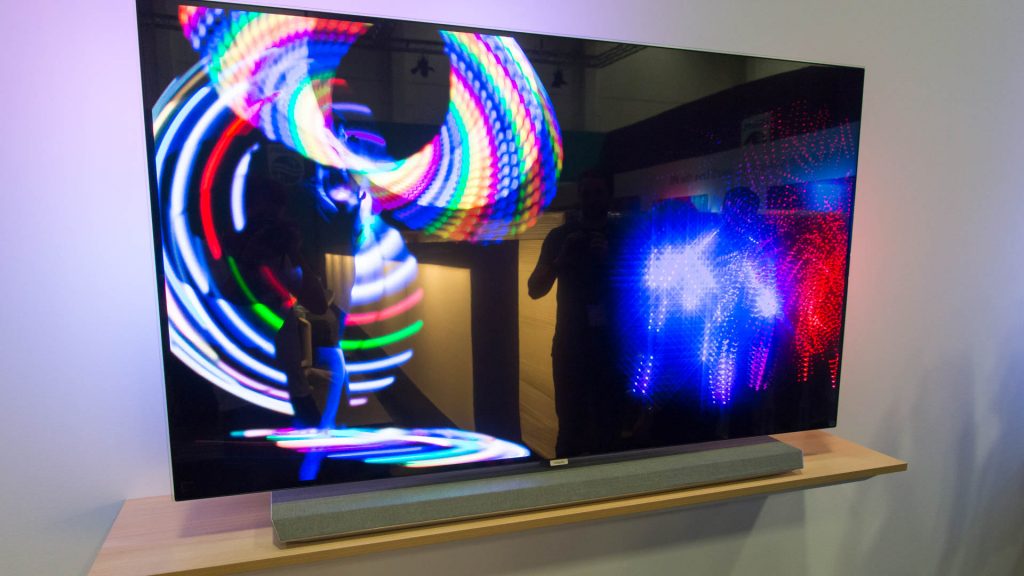 Philips OLED TV displaying vibrant color patterns with reflections.