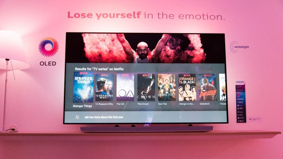 Philips OLED TV displaying Netflix series with ambient lighting.