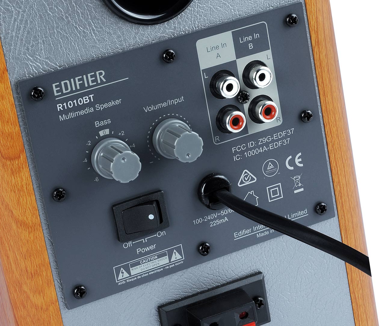 Close-up of Edifier R1010BT speaker's control panel.
