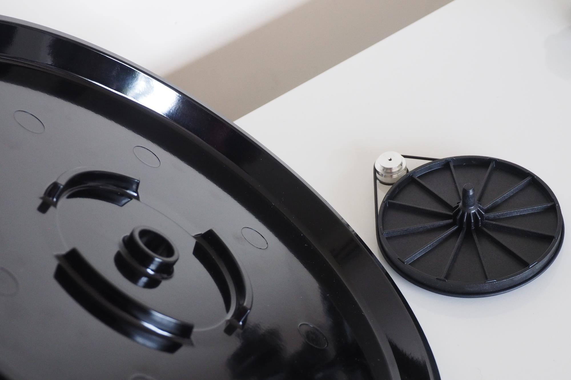 Close-up of Rega Planar 1 turntable platter and counterweight.