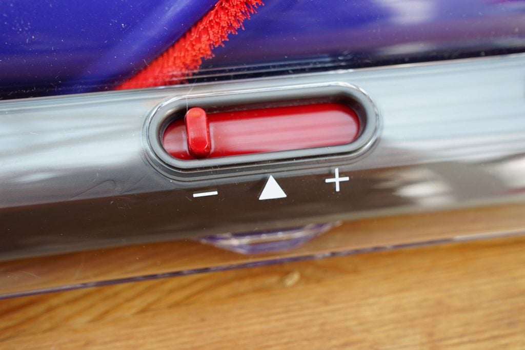 Close-up of Dyson vacuum suction control slider