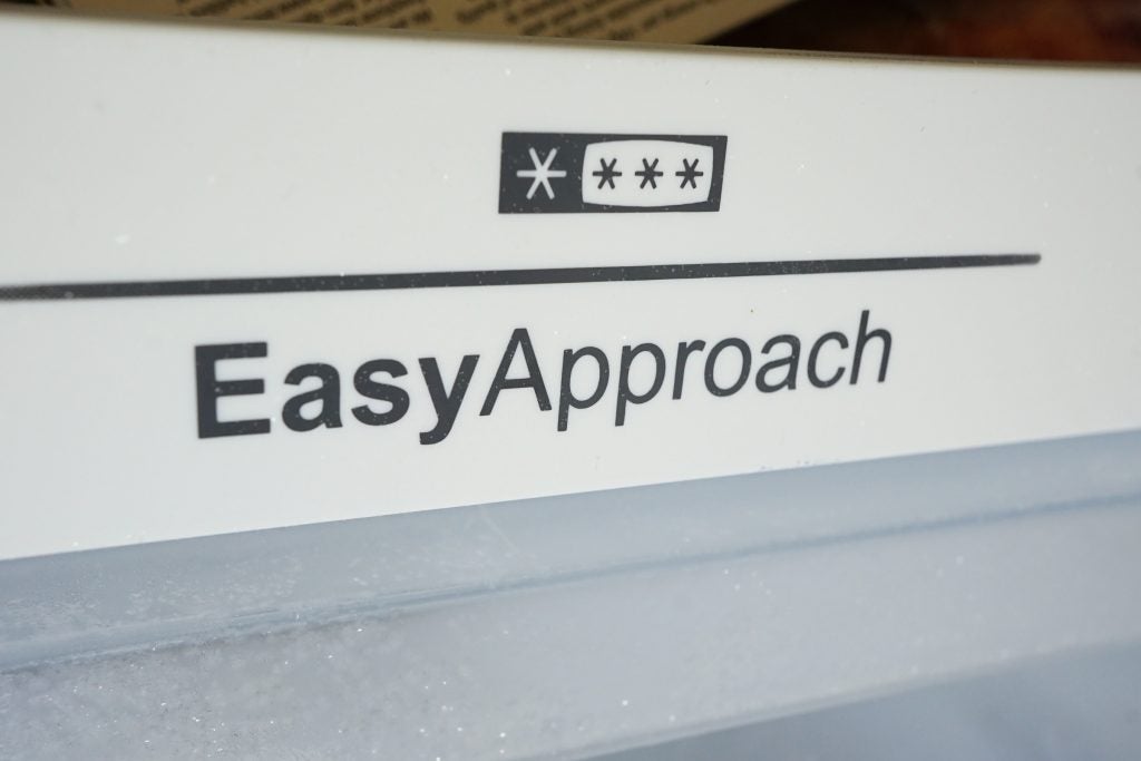 Close-up of EasyApproach label on Hisense fridge interior.