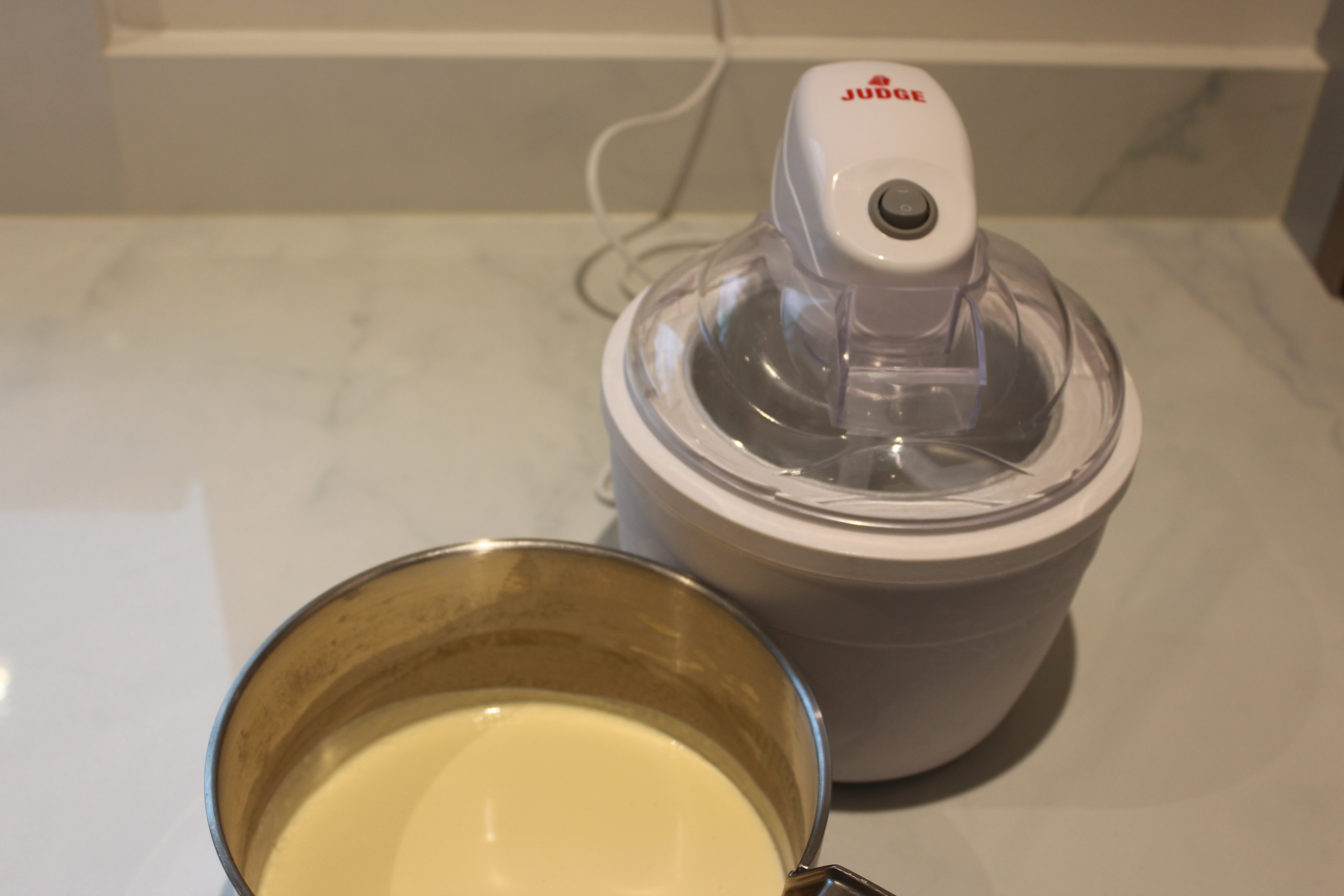 Judge Ice Cream Maker JEA57 next to a bowl of mixture.