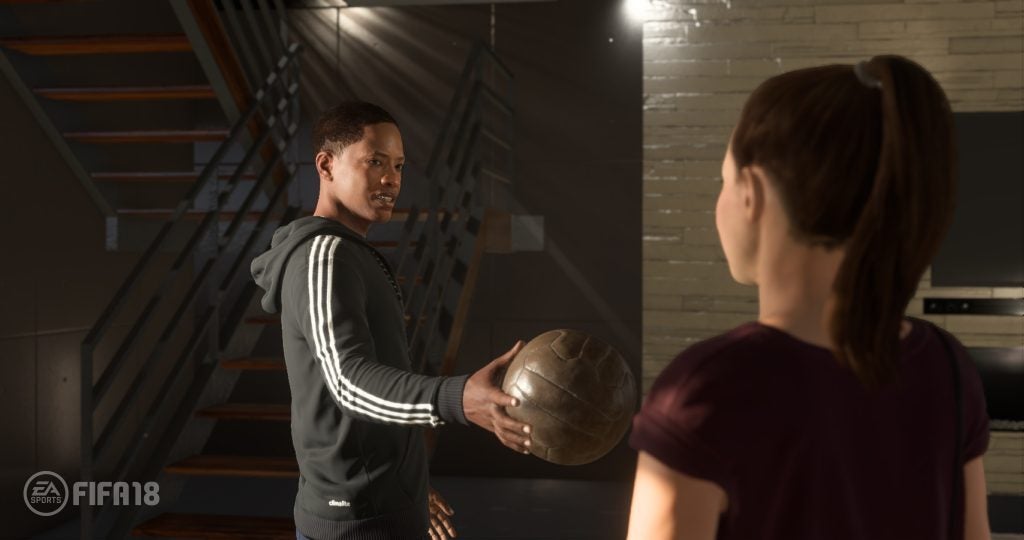 In-game scene from FIFA 18 with two characters and a soccer ball.