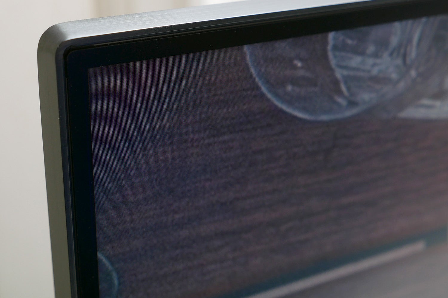 Close-up of Samsung CHG90 monitor edge and screen texture.