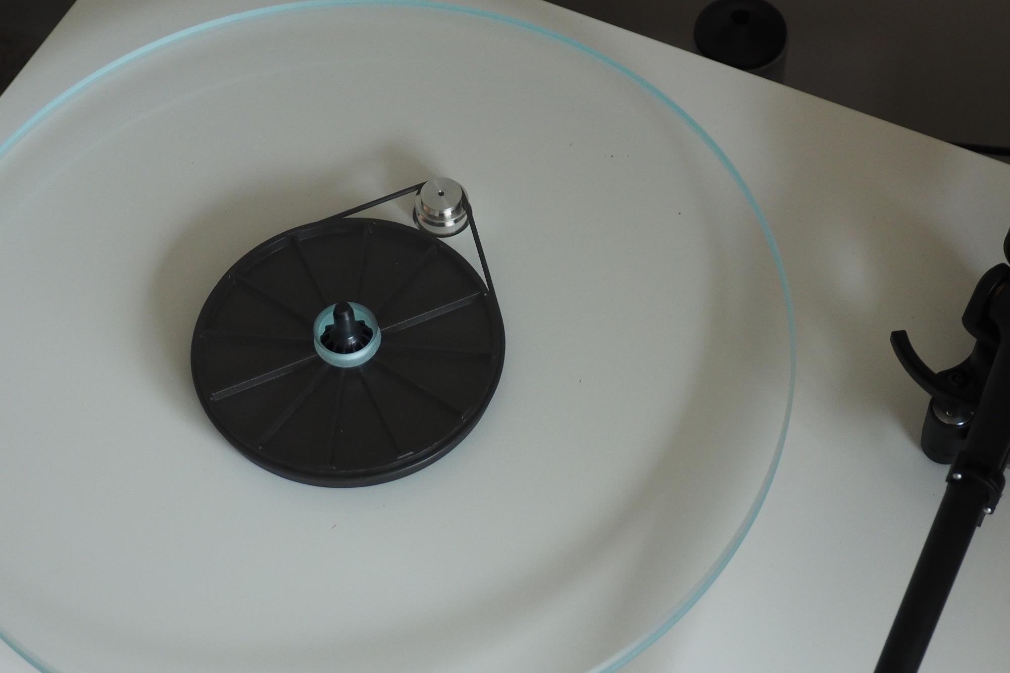 Rega Planar 2 turntable with tonearm and platter visible.