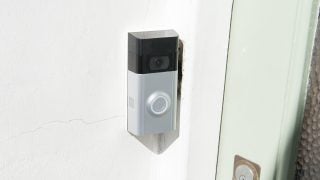 Ring Video Doorbell 2 mounted on house exterior wall.