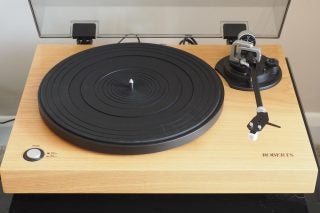 Roberts Radio RT100 turntable on a wooden surface.