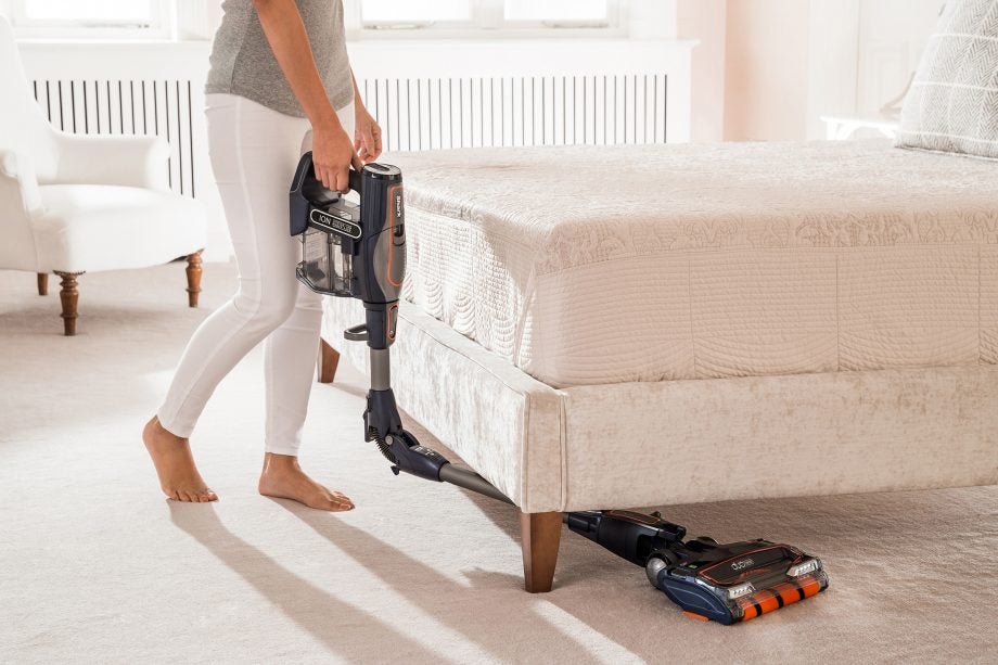 Person using Shark DuoClean Cordless Vacuum under bed