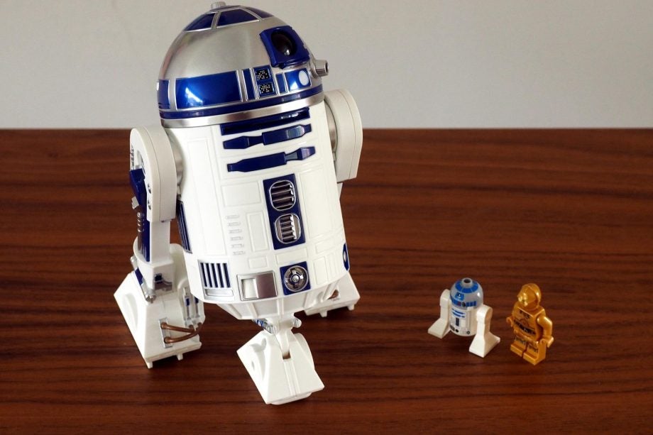 Sphero R2-D2 droid with LEGO R2-D2 and C-3PO figures.
