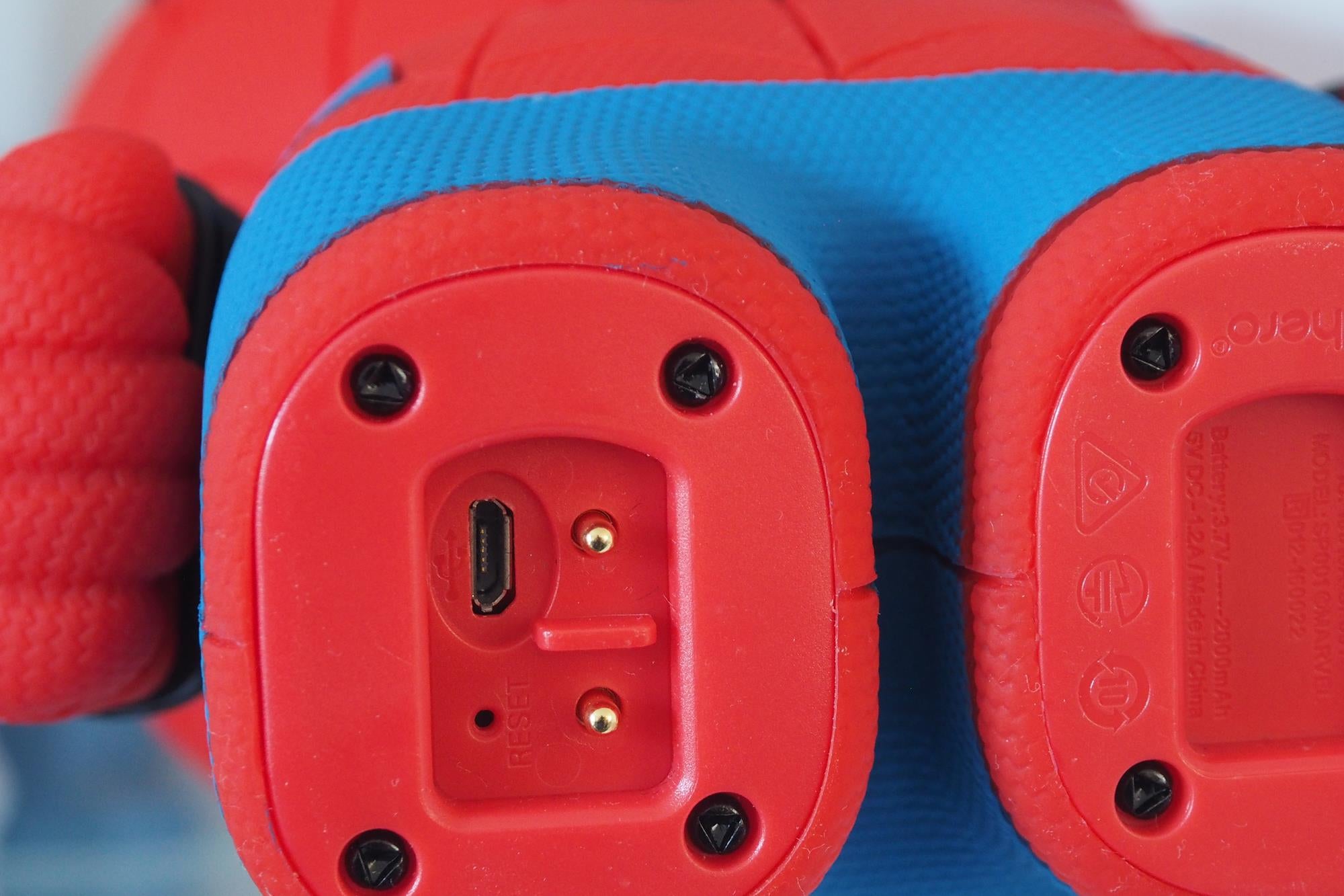 Close-up of Sphero Spider-Man's charging port and reset button.