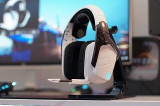Logitech G933 wireless headset on a desk with blurred background.