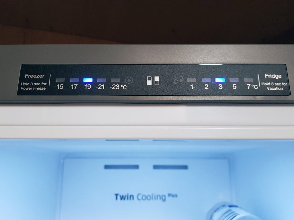 Samsung fridge freezer control panel with temperature settings.