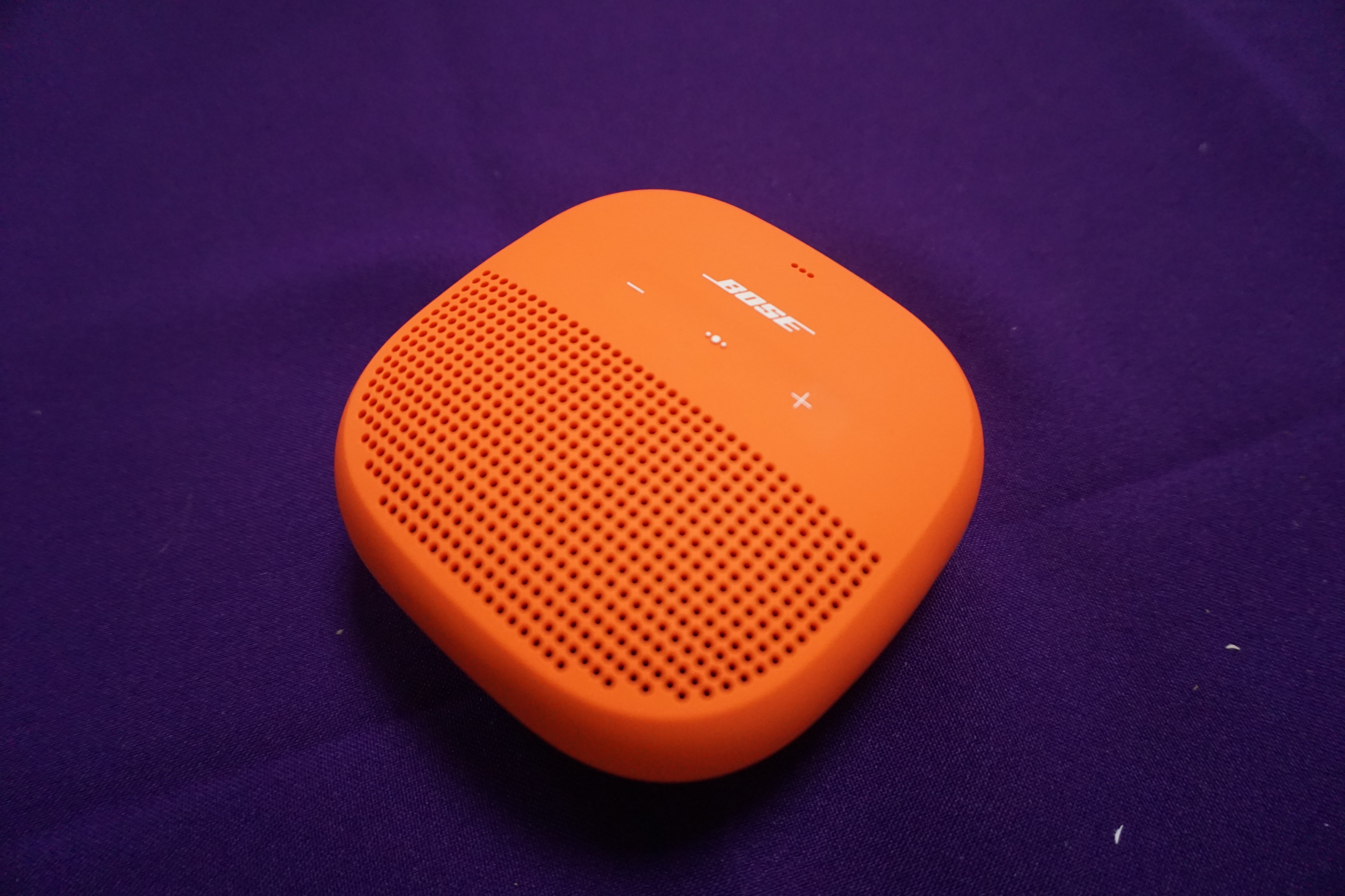 Bose SoundLink Micro speaker on purple background