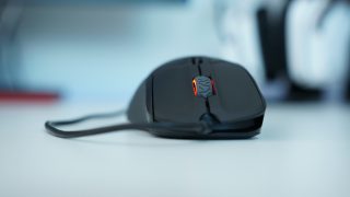 SteelSeries Rival 310 gaming mouse on a desk.