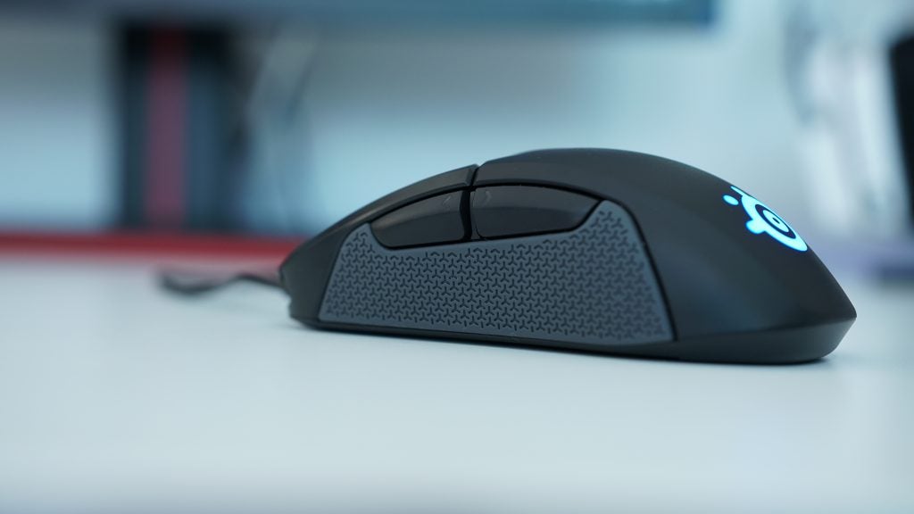 SteelSeries Rival 310 gaming mouse on a white surface.