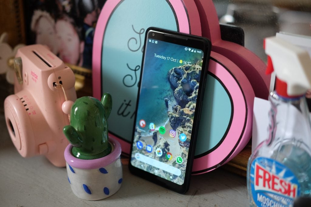 Google Pixel 2 XL smartphone displayed with apps on home screen.