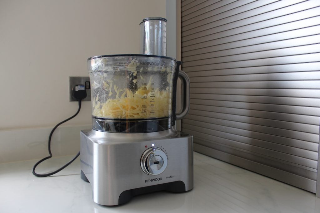 Kenwood Multipro Sense FPM810 food processor with shredded cheese.