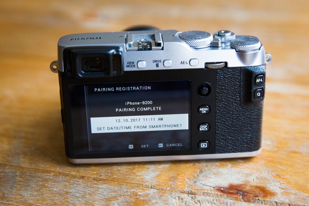 Fujifilm X-E3 camera showing smartphone pairing complete on screen.