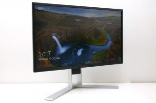 AOC AGON AG271QG monitor with landscape wallpaper displayed.