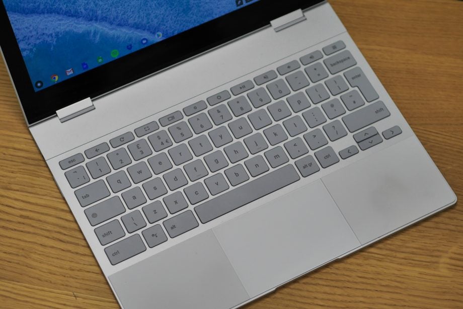 PixelBook laptop keyboard and partially visible screen on desk.