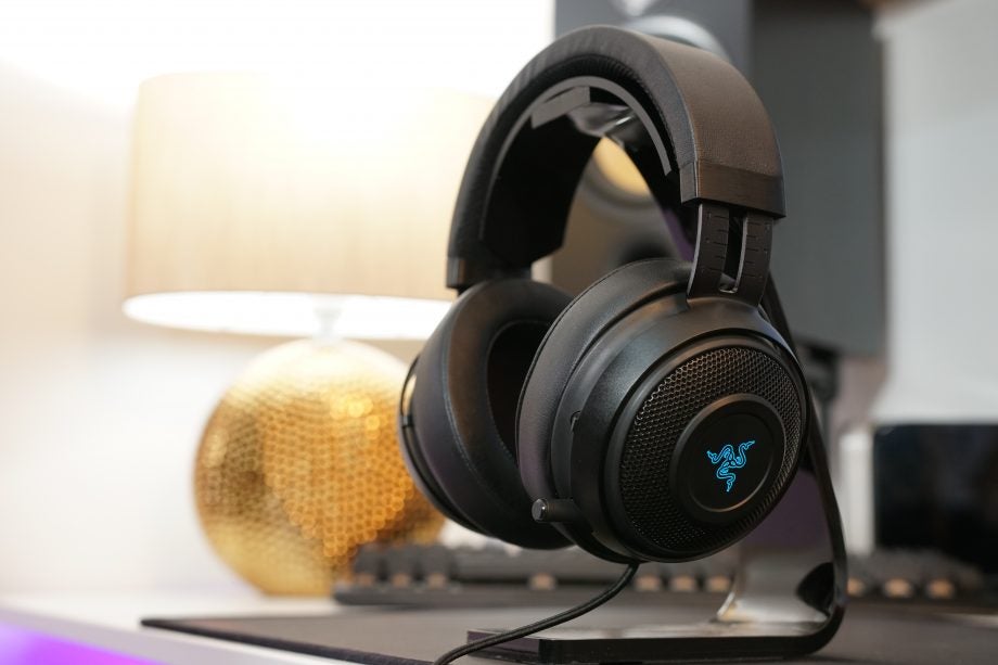 Razer Kraken 7.1 v2 headphones on a stand with backlighting.