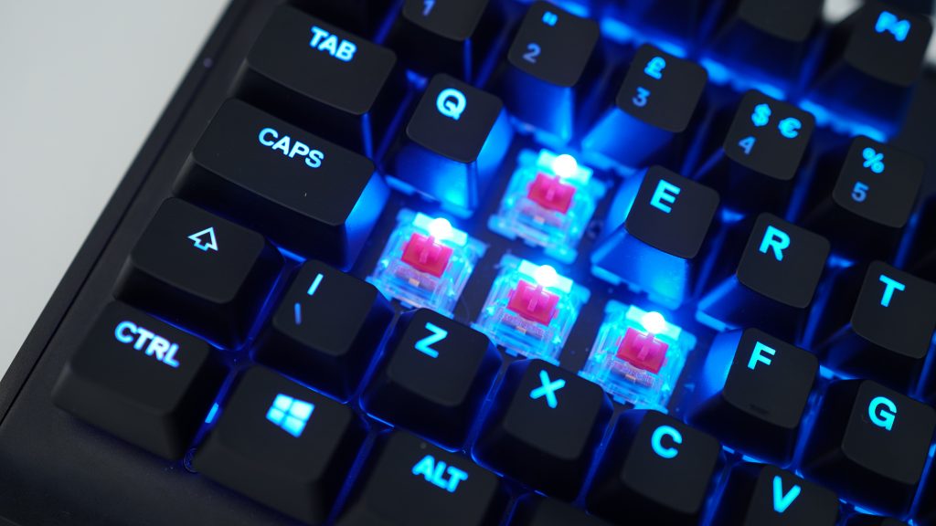 Close-up of SteelSeries Apex M750 mechanical keyboard with RGB backlighting.