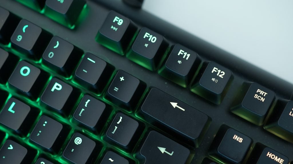 Close-up of SteelSeries Apex M750 mechanical keyboard with RGB lighting.