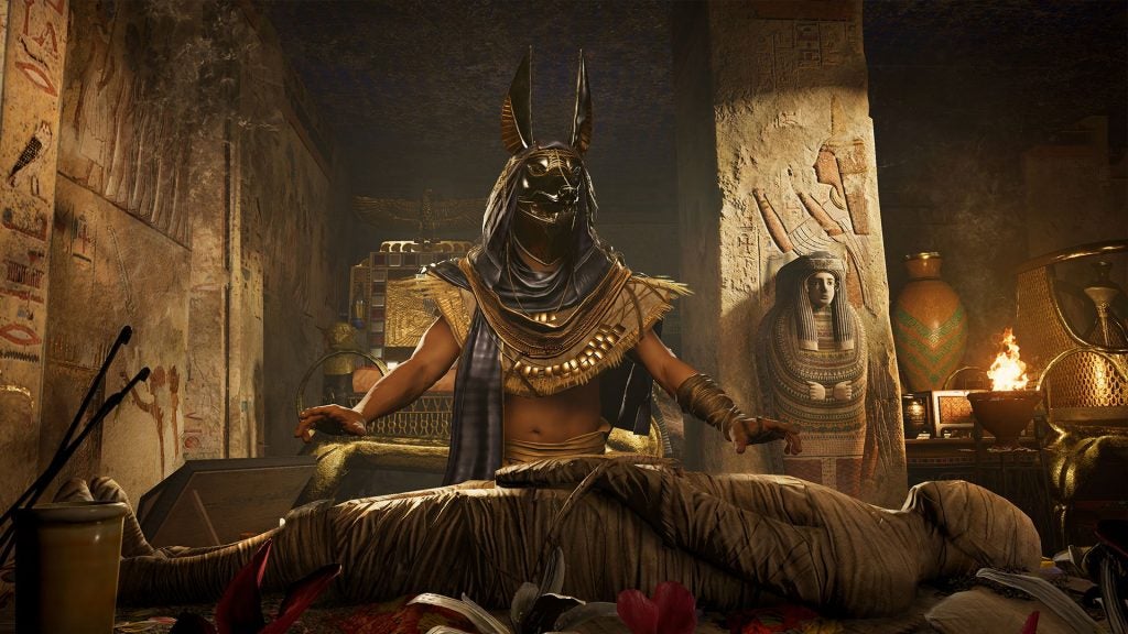 Assassin's Creed Origins character in Egyptian tomb setting.