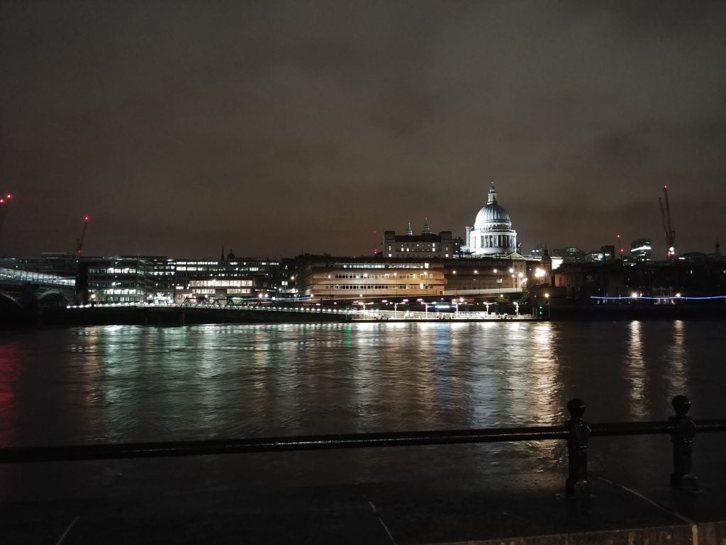 Nighttime river view showcasing camera's low-light performance.